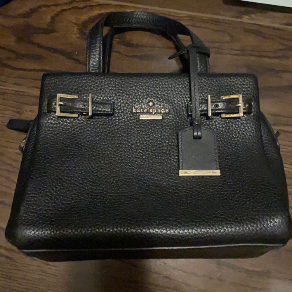 Black top handle Kate Spade bag with strap